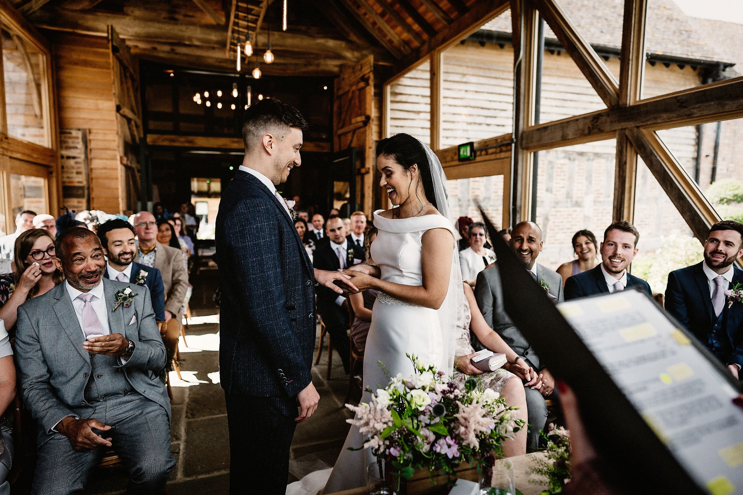 exchanging rings during the barns and yard wedding ceremony